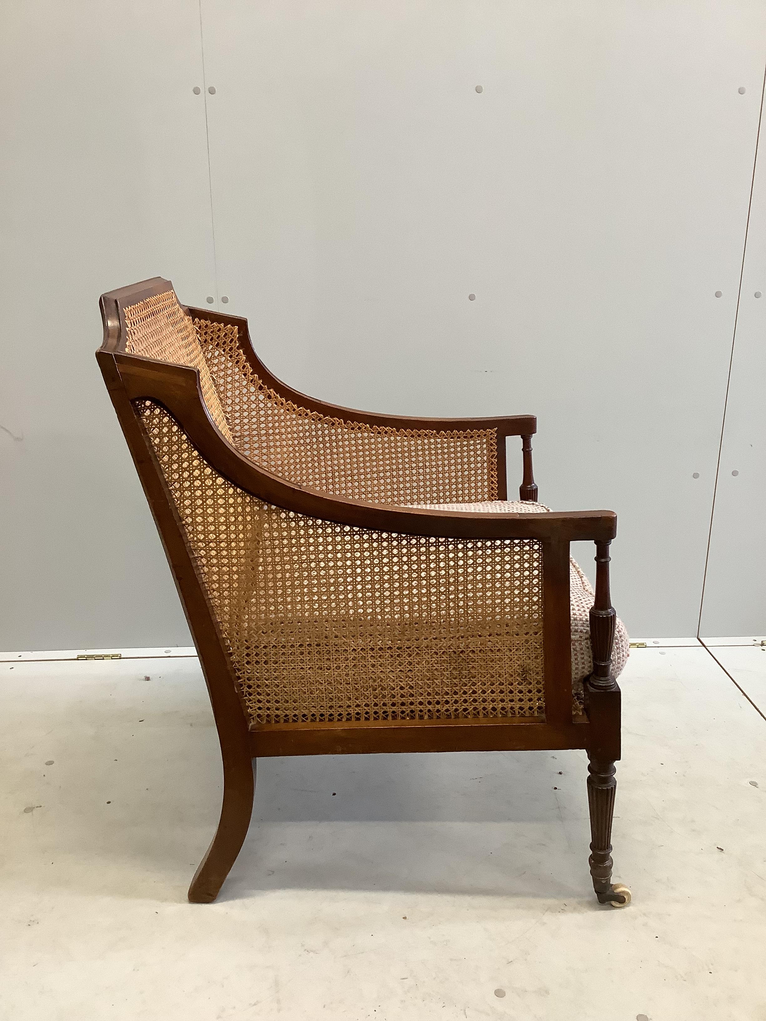 A Regency style mahogany Bergere armchair, width 65cm, depth 72cm, height 96cm